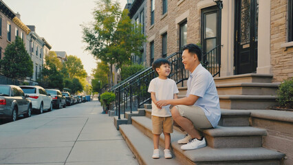 Fototapeta premium A man and a boy sit on the steps of a building, a moment of connection