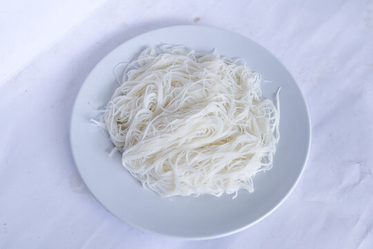 bihun or vermicelli or rice noodles or angel hair served on plate isolated on black background