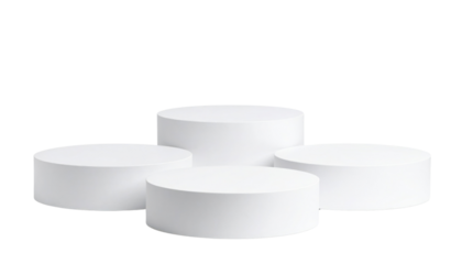 Four white cylindrical podiums of varying heights arranged in a staggered formation.