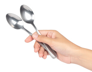 A hand holding two shiny stainless steel spoons with a smooth, reflective surface.