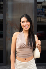Confident Asian Woman Outdoors in Stylish Outfit