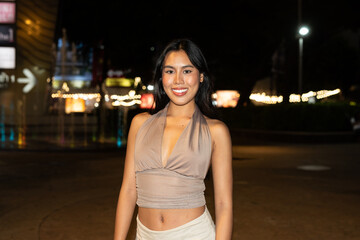 Attractive Woman at Night in Urban City Lights