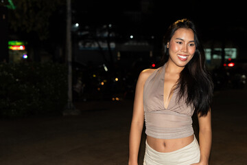 Attractive Woman at Night in Urban City Lights