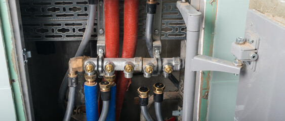 hidden communications in the wall, open door, pipes disconnected from the water supply comb