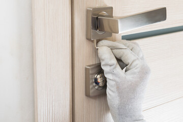 close-up of interior door lock handle installation