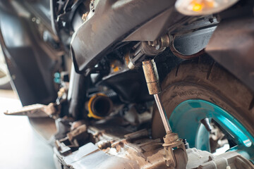 motorcycle rear shock absorbers is broken, damaged rear shock. motorcycle repair concept