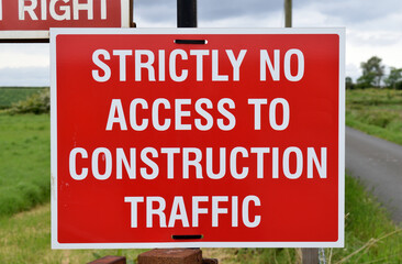 Red Warning Sign 'Strictly No Access to Construction Traffic' in Close Up 