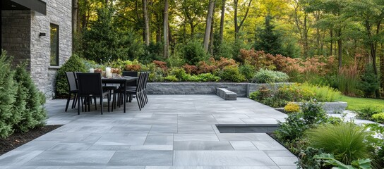 Modern patio with outdoor dining area overlooking lush landscaping