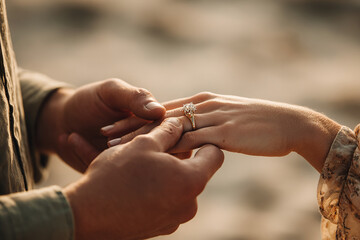 Man give a woman a engagement ring to become husband and wife in a wedding