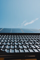 Fototapeta na wymiar Solar panels generating renewable energy on a modern roof