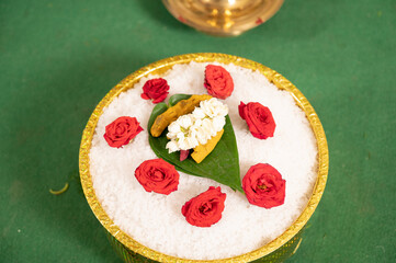 Traditional South Indian Puja Arrangement with Roses and Betel Leaf