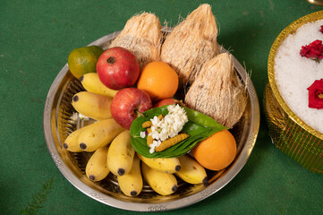 Traditional Indian Offering Plate with Fruits, Betel Leaves, and Flowers
