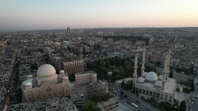 Drone view of a church next to a mosque in Aleppo, symbolizing peaceful coexistence in Syria