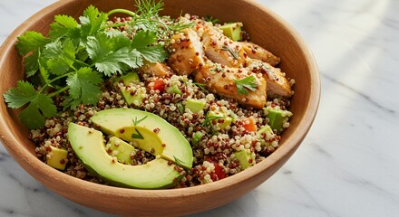 Savor the vibrant flavors of this healthy quinoa salad, featuring grilled chicken, ripe avocado, and fresh cilantro, a perfect blend of textures and tastes.