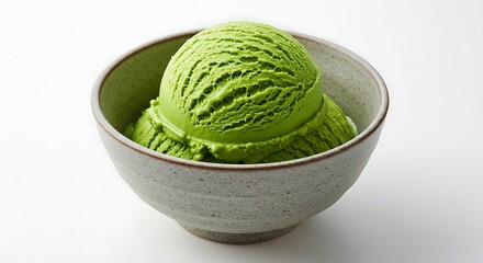 Two perfect scoops of vibrant green matcha ice cream are served in a rustic, handmade ceramic bowl, isolated against a clean white background. 