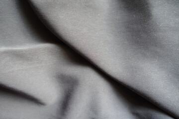 Folded thin simple light gray acrylic fabric