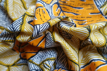 colorful orange, white and blue cotton fabric in folds