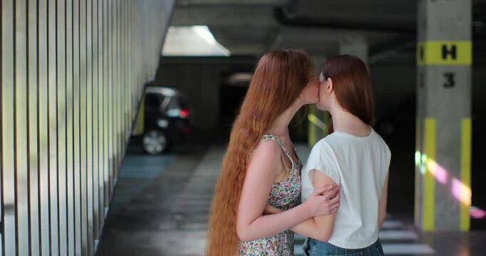 Two lesbian woman lgbt couple hugging, kissing. Concept of LGBT happiness, freedom, love homosexual couple.