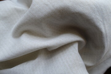 pale beige cotton fabric with circles pattern in soft folds