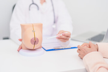 woman Patient consultation with doctor for Breast Augmentation Surgery, October Breast Cancer Awareness month, implant, Diagnosis, Beauty woman enlargement and medical healthcare concept
