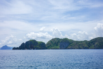 A beautiful landscape of a majestic mountain range over the deep blue sky. A clear summer sky with...