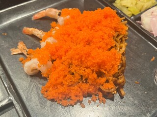 Dry-style Northern Thai Curry Noodles with shrimp on topped with shrimp roe and pickle crispy noodle