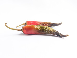 Rotten red chili with black color at the tip of the fruit