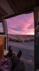Relaxed feet at sunset, gazing out from a camper van.