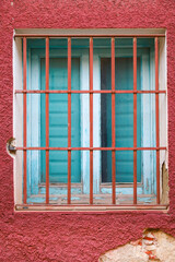 Stone facade with window with wrought iron lattice in Spain