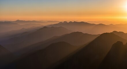 Fototapeta premium Scenic Mountain Range with Golden Sunrise Haze Landscape View