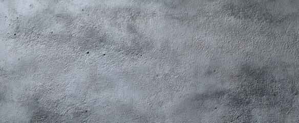 Naklejka premium The textured gray concrete surface ideal for backgrounds and design elements.