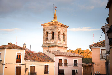 Bell tower of Santa Maria Del Salvador church under blue sky in The old town of Chinchilla de Montearagon