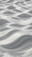 Obraz premium Abstract monochrome image of blurry curved wave patterns in gray and white tones creating a textured and undulating
