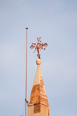 Vane of the Bell tower of Santa Maria Del Salvador church plenty of birds in The old town of Chinchilla de Montearagon