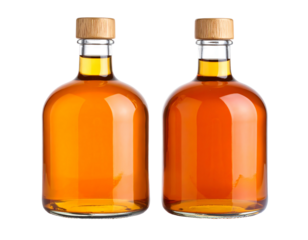 Two glass bottles of amber liquid.