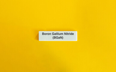 Boron Gallium Nitride BGaN on Letter Tile Against Yellow Background – Minimal Science Concept