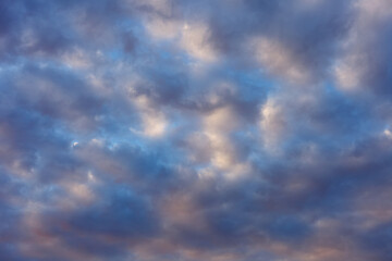 Evening dramatic sky and small dark clouds