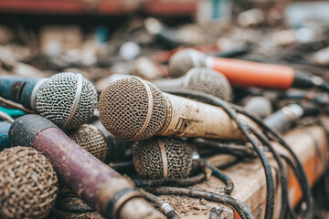 Broken microphones as concept of war press