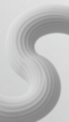 Smooth curved shape in shades of gray against a light gray textured background