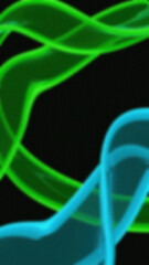 Abstract blurred curves in green and cyan hues against a dark black background forming an interesting and luminous