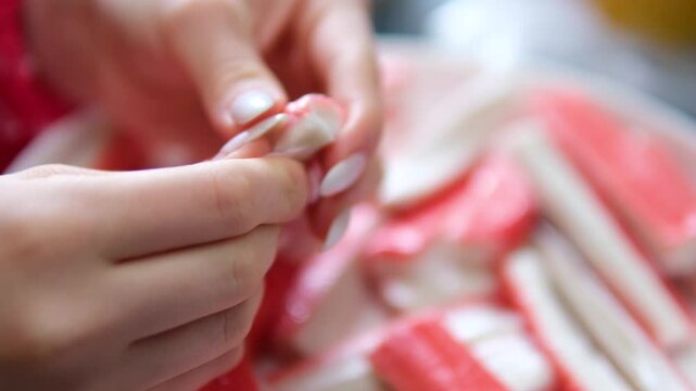 cleaning crab sticks by hand for sushi. High quality 4k footage