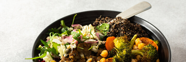 A vibrant, protein-packed breakfast with black quinoa, avocado, chicken, roasted veggies like sweet potato, broccoli, and a fresh salad of cabbage, radish, chia, and sesame seeds, banner