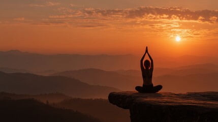 Woman meditating in yoga pose on mountain top at sunrise — mindfulness and nature balance concept