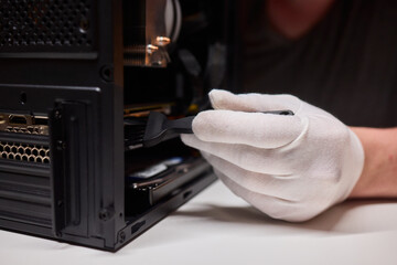 Cleaning a processor fan with a brush