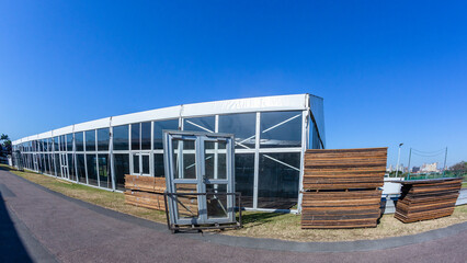 Large portable canvas tent structures with clear plastic perspex walls.