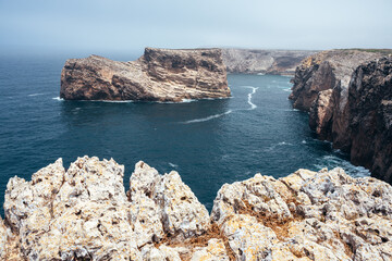 San Vicente Cape cliffs in the Algarve region of Portugal in a sunny day.