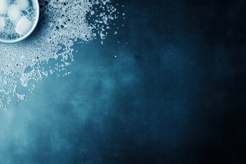 Refreshing Bubbles and Ice in a Glass on a Dark Blue Background