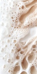 Creamy Coffee Foam with Swirls and Bubbles on White Background
