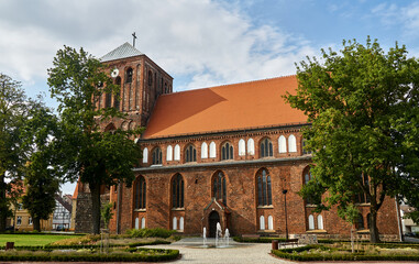 Gothic, historic church with a clock tower in Strzelce Krajenskie