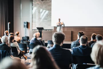  Speaker giving a talk in conference hall at business event. Rear view of unrecognizable people in audience at the conference hall. Business and entrepreneurship concept © kasto